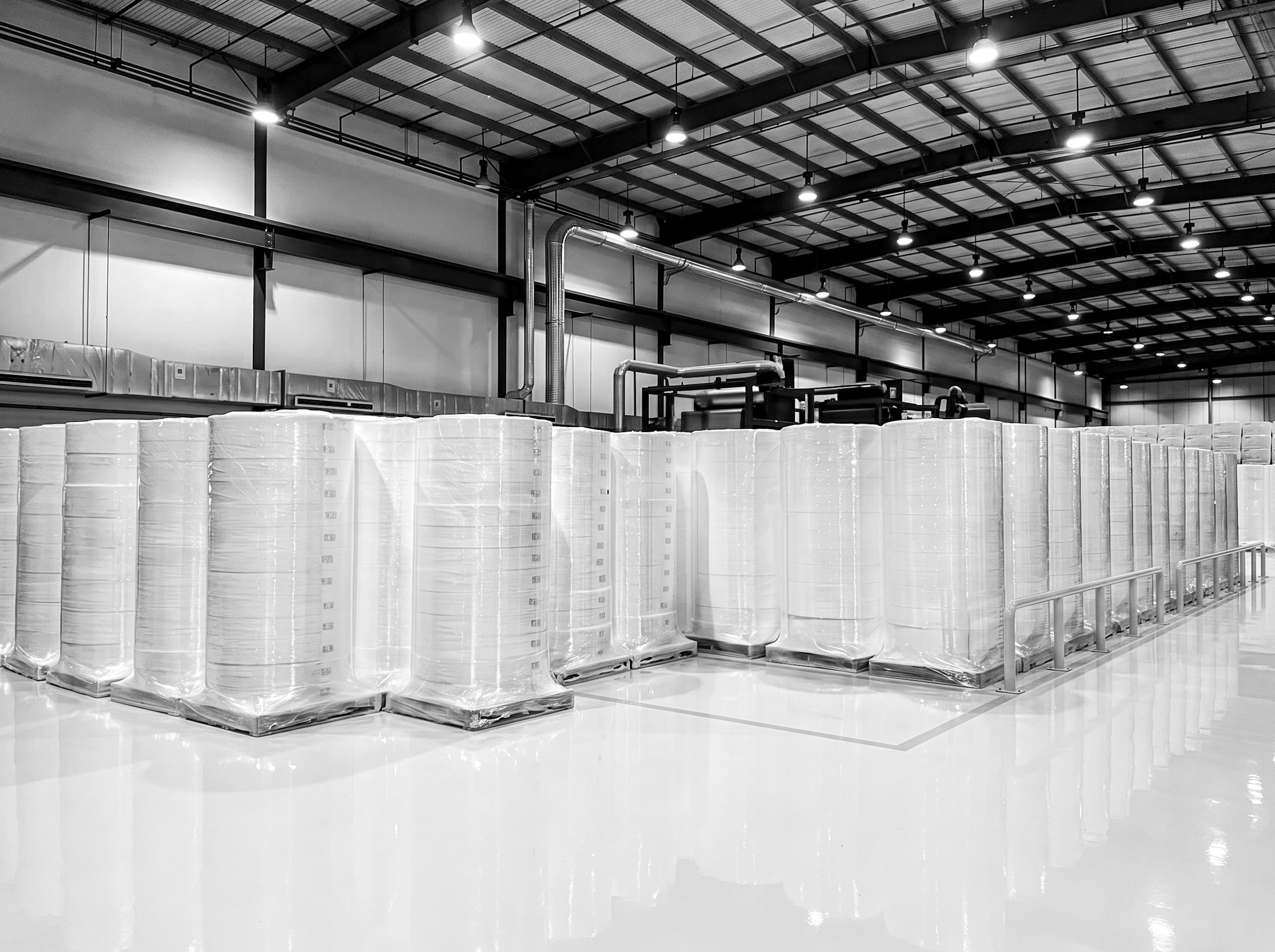 Industrial nonwoven production line with quality monitoring